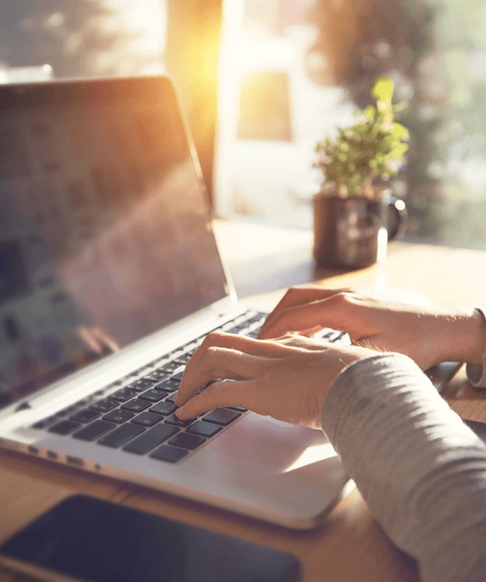 Woman typing on laptop