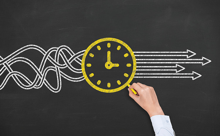A chalkboard with a clock and arrows