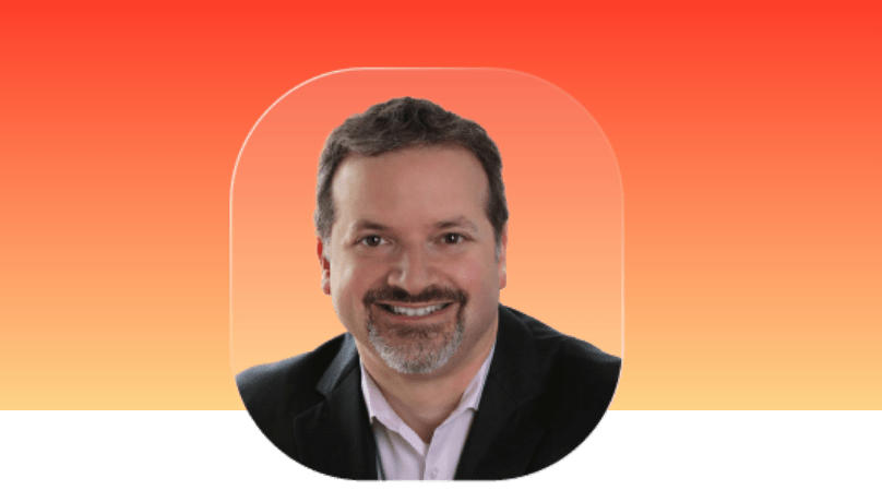 headshot image of bearded man smiling