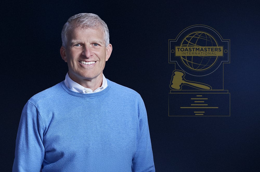 Man in blue long-sleeved shirt smiling