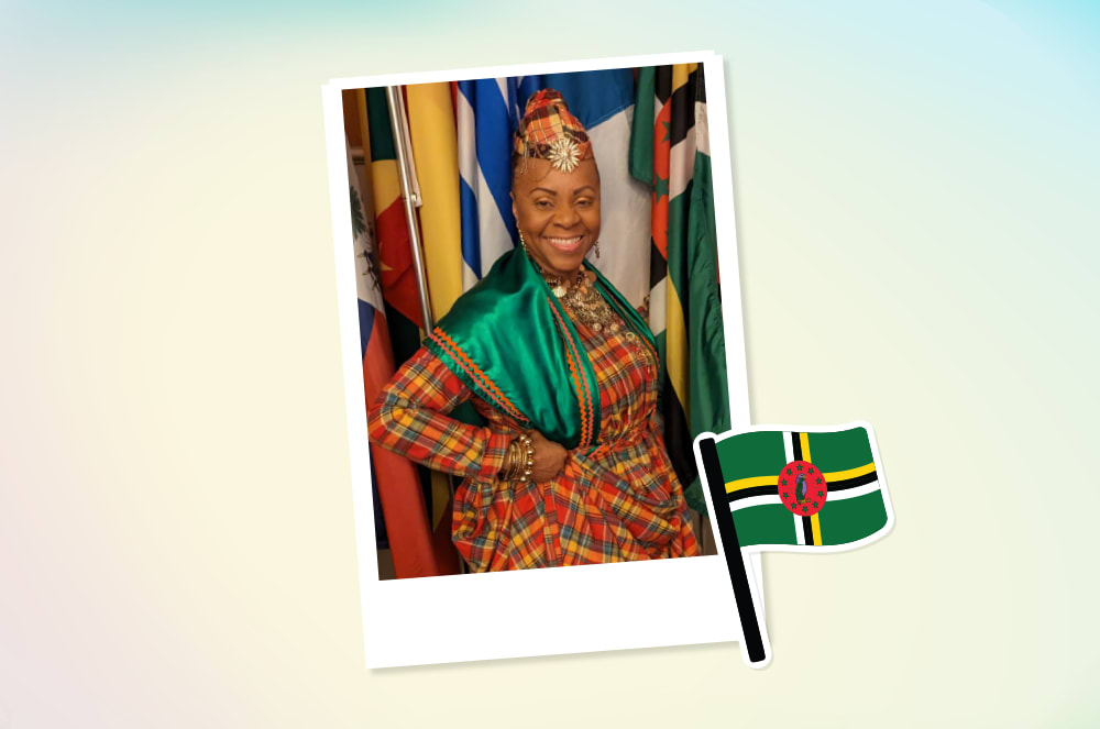 Smiling woman wearing red and green traditional Dominica attire