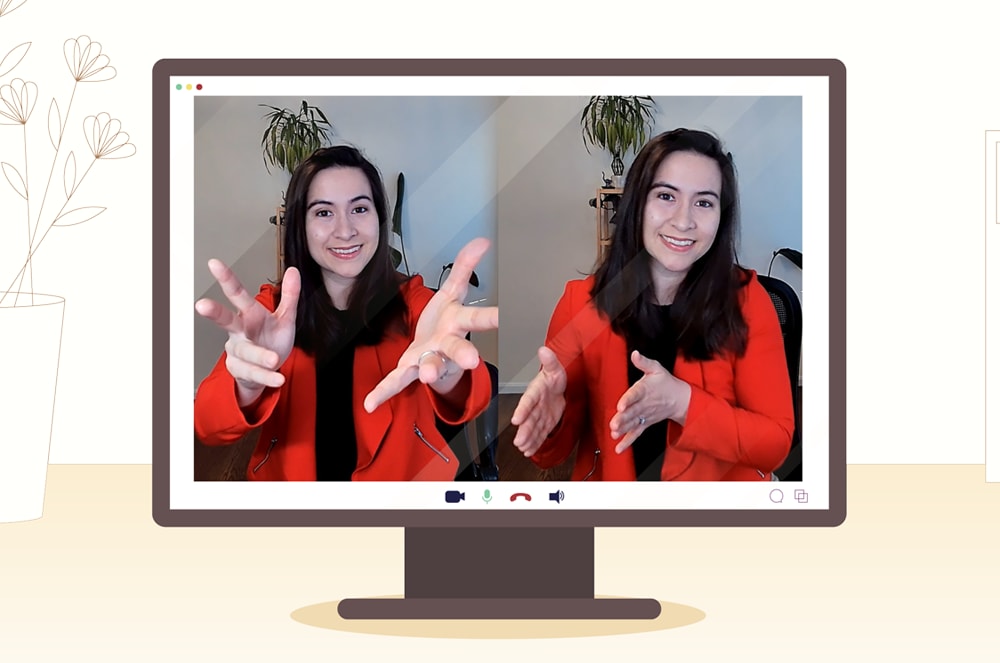 A woman wearing a red jacket showing hand movements on a computer screen