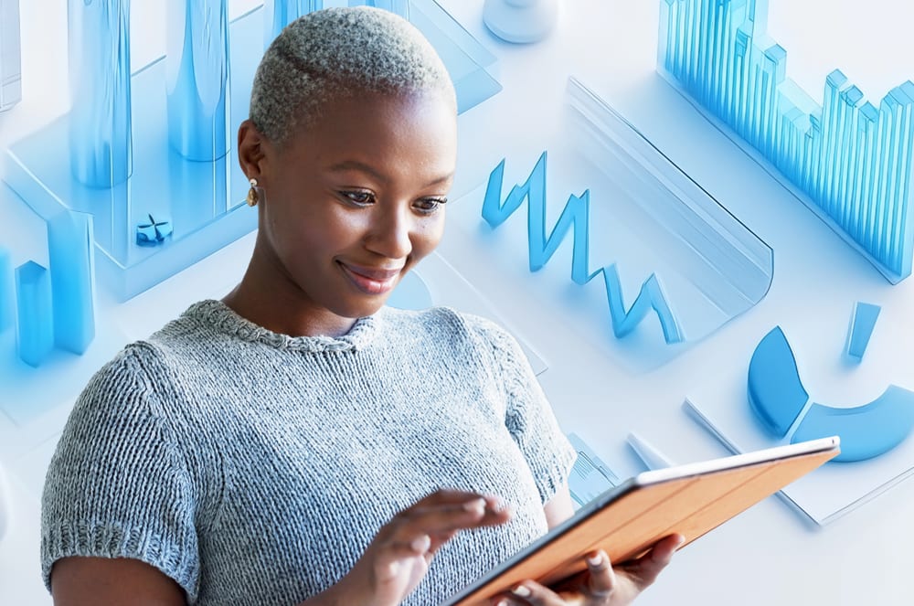 A young woman with short gray hair is holding a tablet device in front of a background of various blue geometric shapes.