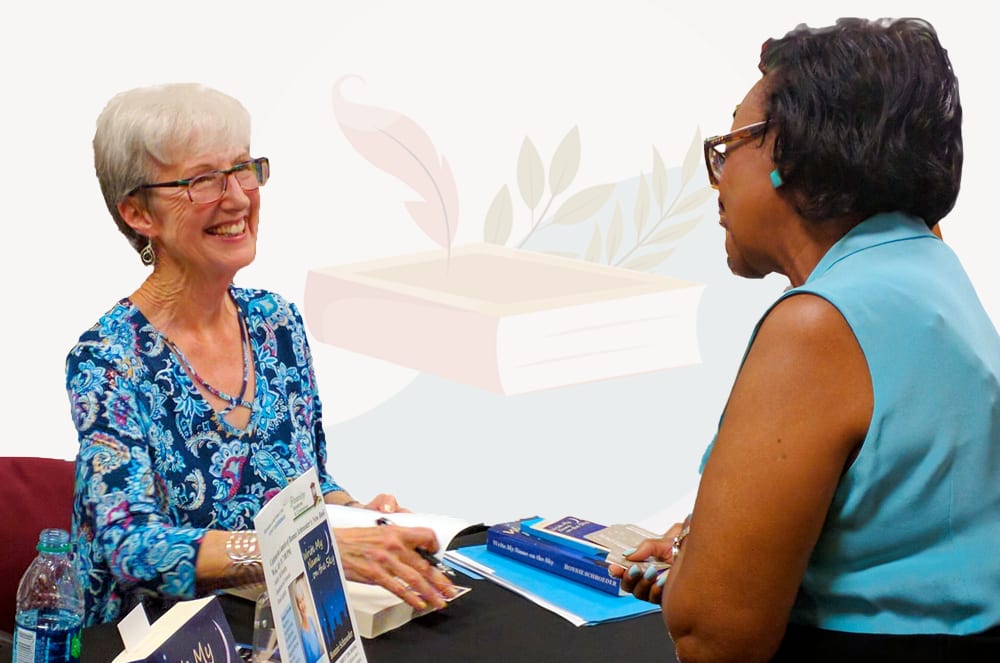 The image shows an elderly woman with gray hair and glasses behind a counter, smiling and interacting with a younger woman wearing a teal shirt. In the background, there are bookshelves filled with various books and other items.
