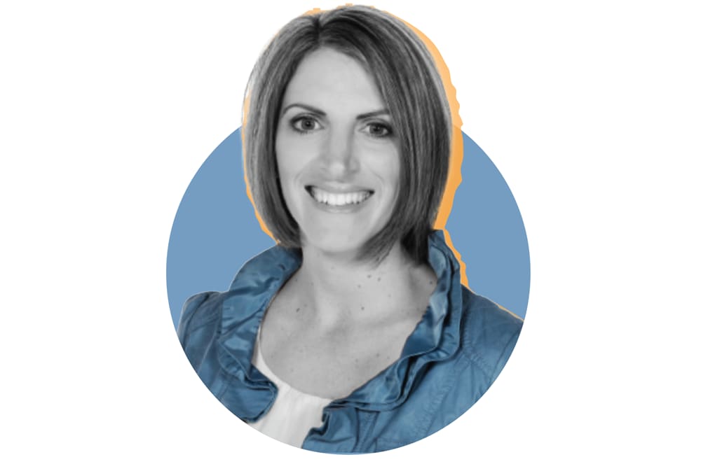 The image shows a smiling woman with long dark hair wearing a blue denim shirt against a blue background.