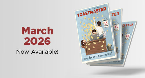 The image features a poster advertising the "Toastmaster" product, with a person standing on a stack of books and surrounded by stars. The background is a plain, light-colored surface, and the text "March 2026 Now Available!" is prominently displayed at the top of the image.