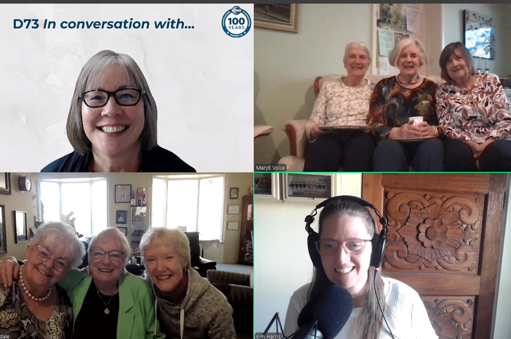 The image shows a video call with several older women, some seated together and others appearing individually on the screen. The background includes various home furnishings and decor, suggesting a comfortable, domestic setting.
