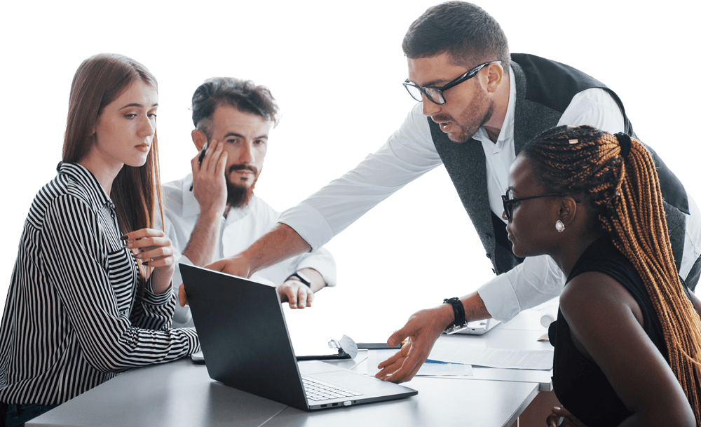Four people are gathered around a laptop on a table, with a white background.