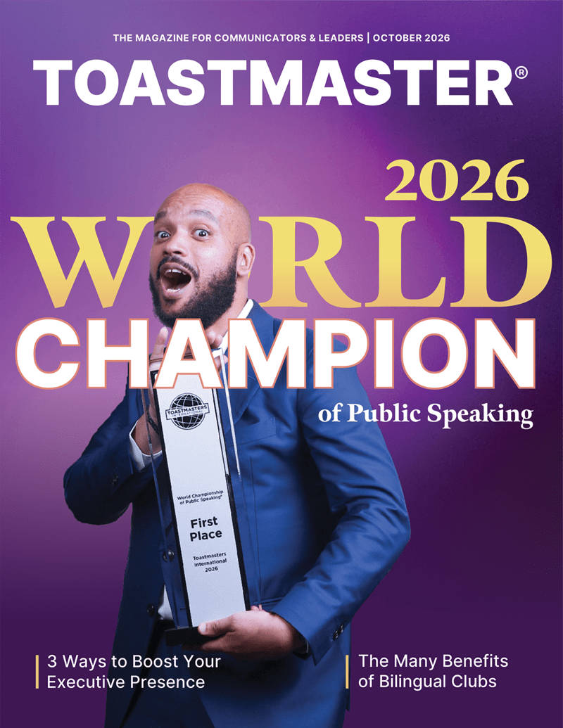 A man holding a trophy in front of a purple background with the words “2026 World Champion” around him