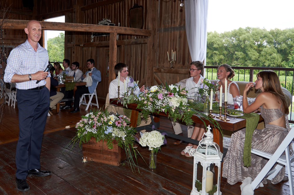 Man standing and giving a wedding speech