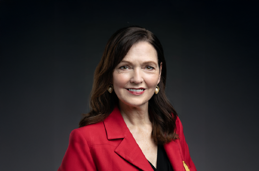 Portrait of woman in red jacket smiling