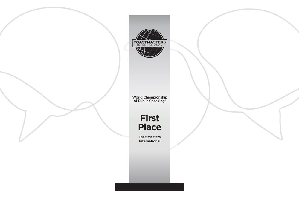 A silver trophy with the Toastmasters International logo on the top and the words “World Championship of Public Speaking” and “First Place” in the middle