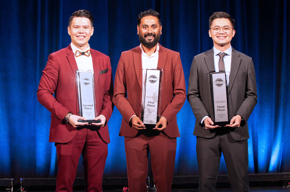 The winners of the World Championship of Public Speaking after the competition. From left to right, second-place winner Mas Mahathir Bin Mohamad, first-place winner Sabyasachi Sengupta, and third-place winner Allen Ang Boon Kiat, DTM.