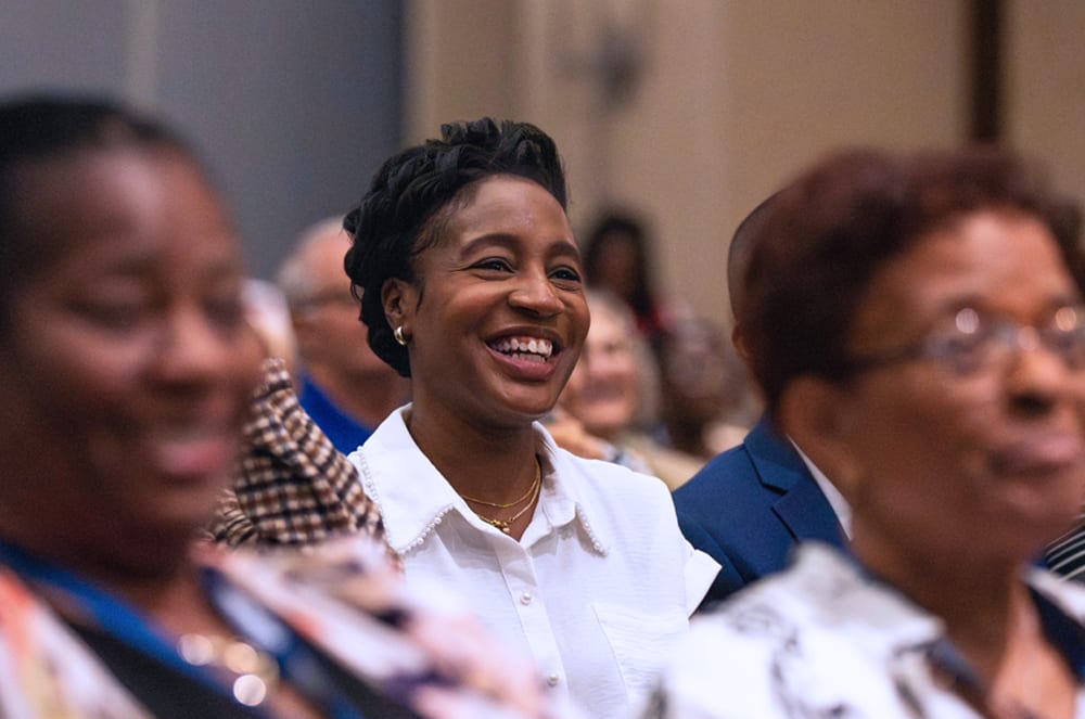 A convention attendee enjoys an education session.