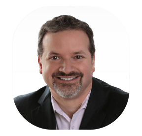 Headshot of a bearded man smiling