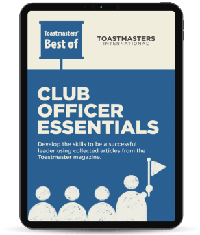 Tablet showing blue “Club Officer Essentials” Toastmasters booklet with figures and flag icon.