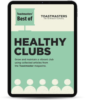 Tablet showing green “Healthy Clubs” Toastmasters booklet with illustrated figures.