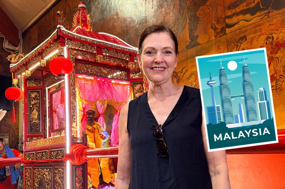 A smiling woman wearing a black shirt inside of a temple