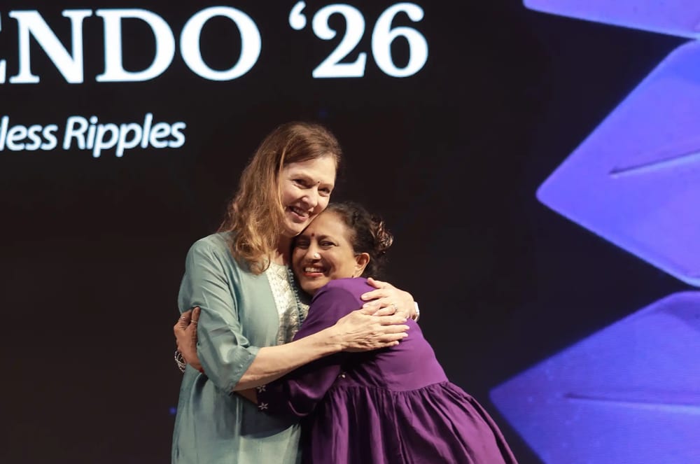Hugging a member at the District 121 conference in India.  Photo credit: Varadham Media
