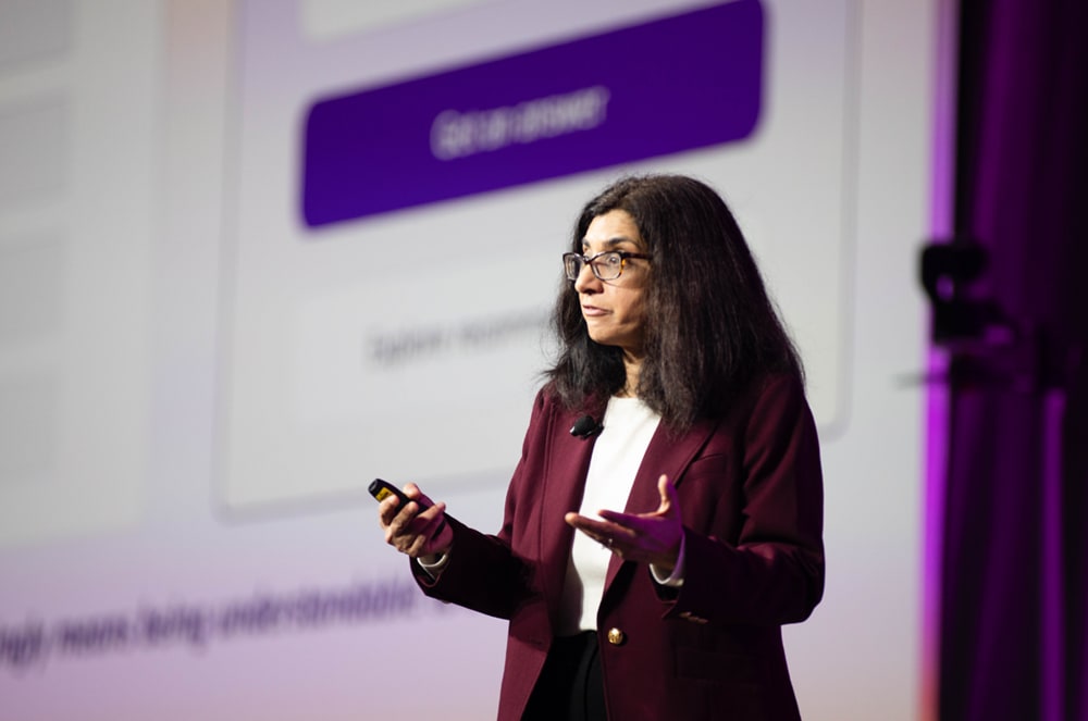 Mariam Tariq presents AI tips for Toastmasters.